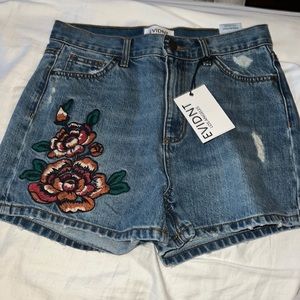 Brand New Denim Shorts with embroidered design on them.